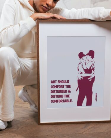 Bansky - Art Should Comfort... Red/White Poster